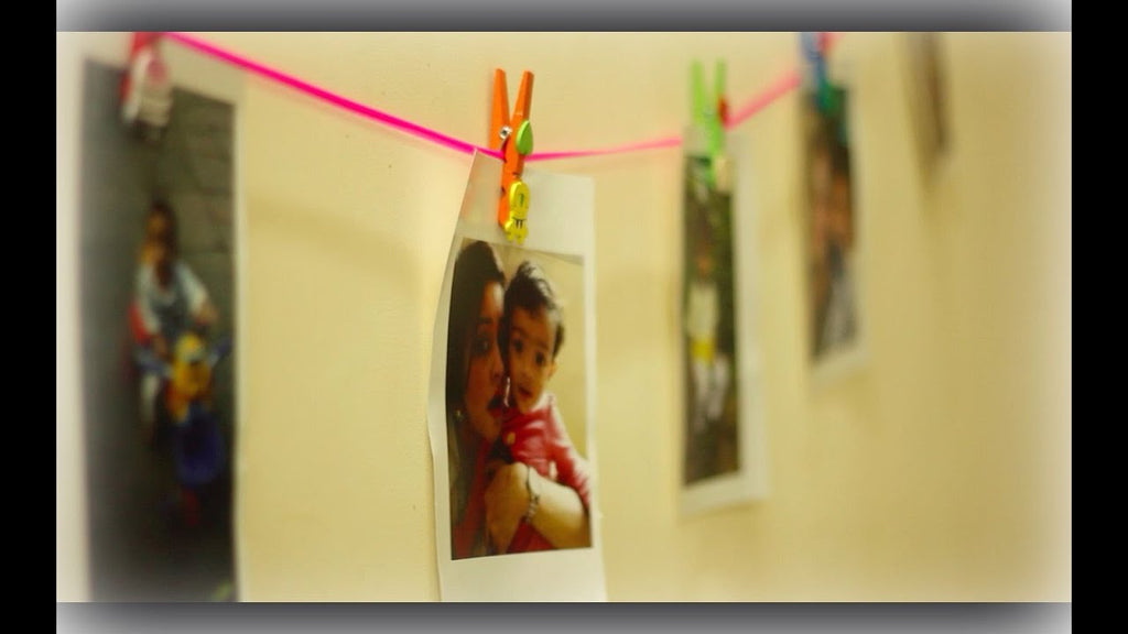 A simple way to clip your pics on the wall with a DIY String based holder