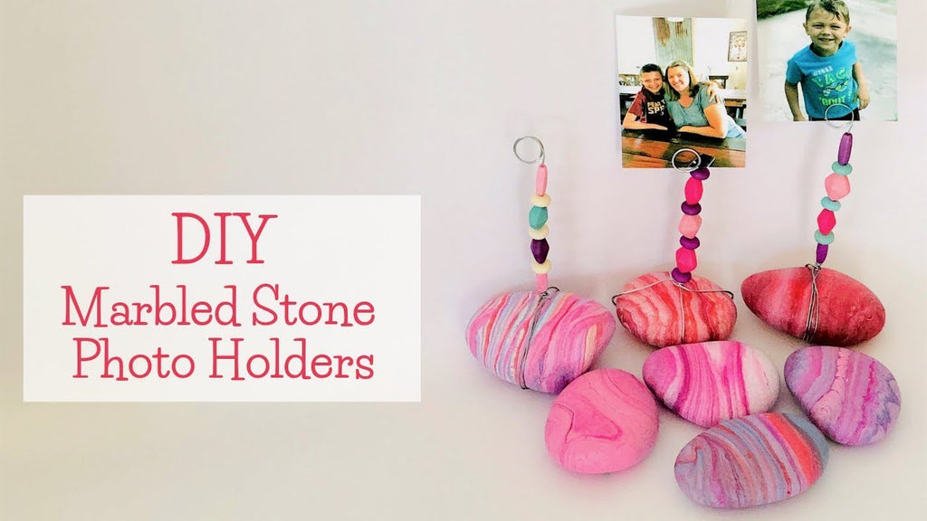 Rock Painting Guide shows you how to do acrylic paint pouring on rocks to make these marbled stone photo holders for Valentine's Day, Mother's Day, or any ...